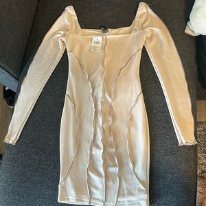 White mini long sleeve dress with caramel color detail. New with tags